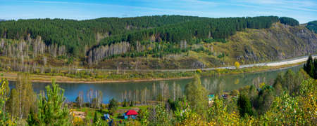 Railway track along the Bank of the Kondoma river near the village of Mundybash in Gornaya Shoria,...