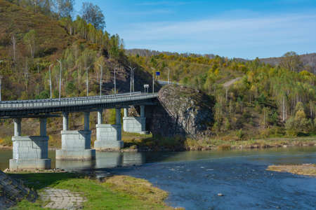 Automobile bridge over the Kondoma river in the village of Mundybash, Gornaya Shoria, Kemerovo region-Kuzbassの写真素材