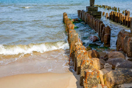 Svetlogorsk, the foundation of the old destroyed breakwater on the city beachの写真素材