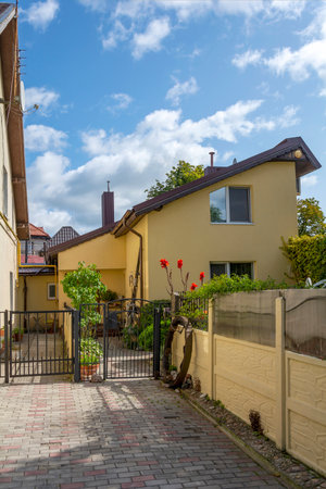 Backyard with a small garden at a residential building in the resort town of Zelenogradsk, Kaliningrad regionの写真素材