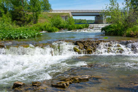 Picturesque threshold and dam with spillway on the Suenga River, Novosibirsk region