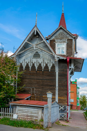 Tomsk, an old wooden apartment building on Kuznetsova Street, traditional Tomsk landscapeの写真素材