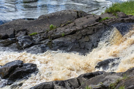Ahvenkoski Waterfall on the stormy Tohmajoki River. Republic of Kareliaの写真素材