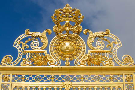Beautiful gate of Versailles palace detailed fence near Paris isolated on white background- Golden...