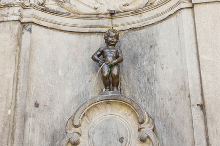 BRUSSELS - MAY 16: Close Up from Manneken Pis statue on May 16, 2014 in Brussels, Belgium. This statue is landmark of Brussels and due to repeated thefts only the replica is exposed.のeditorial素材