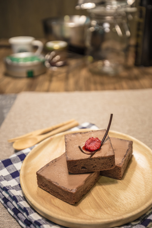 Homemade chocolate tart on a wooden boardの写真素材