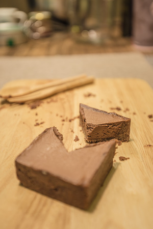 Homemade chocolate tart on a wooden boardの写真素材