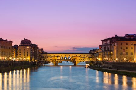 Twilight of Ponte Vecchio the ancient bridge of Florence, Italyの写真素材