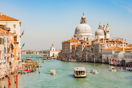 Venice, Italy - April 12, 2015: Gondola with the tourist in Venice, Italy. The gondola is a traditional, flat-bottomed Venetian rowing boat, well suited to the conditions of the Venetian lagoon.のeditorial素材