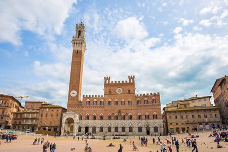 Siena, Italy - April 11, 2015: View of Piazza del Campo (Campo Square), the Mangia Tower landmark of Siena in Italy.のeditorial素材