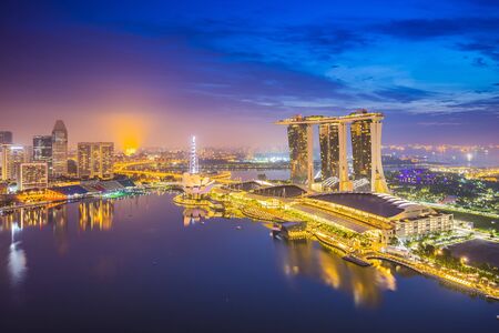 Singapore city skyline and view of Marina Bay at night in Singapore city.のeditorial素材