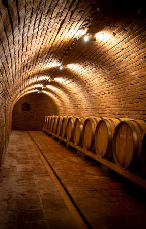 Wine barrels in the cellar of the winery. High quality photo