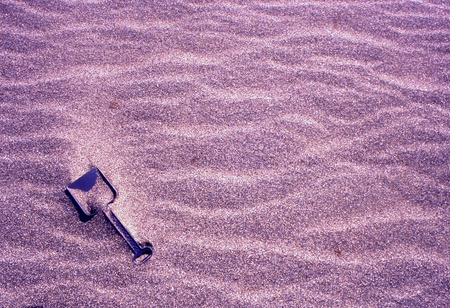 childs paddle on sandの写真素材
