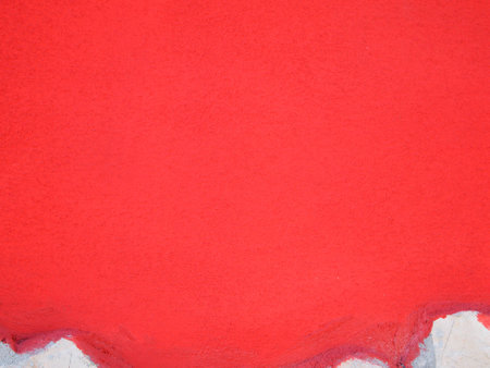 Painted wall with a hint of red coating of travertine