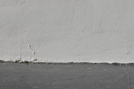 White wall of the old gray floor