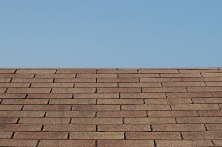 brick wall with sky in the background