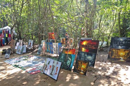 SIEM REAP, CAMBODIA - December 22, 2013 :  Local Cambodian artist work at Ta Som temple in amazing Angkor, Siem Reap, Cambodia. Angkor is a popular tourist attraction.のeditorial素材