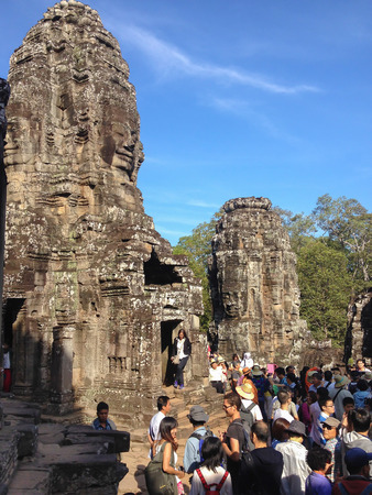SIEM REAP, CAMBODIA - December 21, 2013 : Tourists at Bayon Temple, Angkor Archaeological Park, Siem Reap Province, Cambodia.のeditorial素材