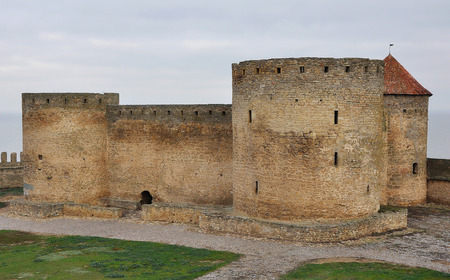 Medieval citadel with three round towers on the background of the seaの写真素材