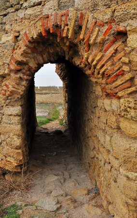 The arched roof of the passageway in the wall of the fortressの写真素材