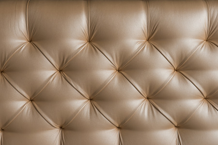 Leather upholstery. Background of expensive furniture. The texture of quilted furniture.の写真素材