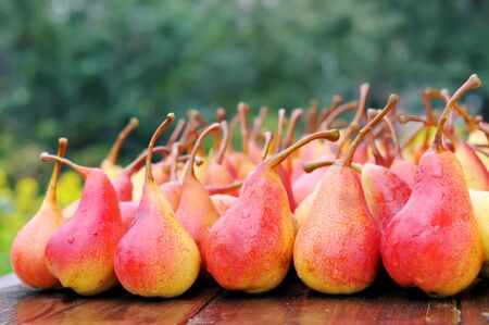 Ripe pears on a wooden tableの写真素材