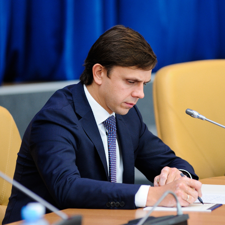 Orel, Russia, October, 7, 2017: New Orel Governor presentation. Andrey Klychkov makes notes closeupのeditorial素材