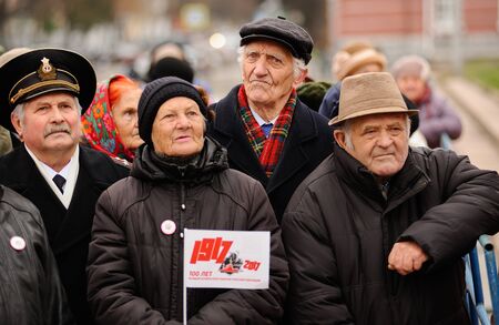 Orel, Russia, November 7, 2017: October Revolution anniversary meeting. Sad senior people in dark clothes with 1917 sign flagのeditorial素材