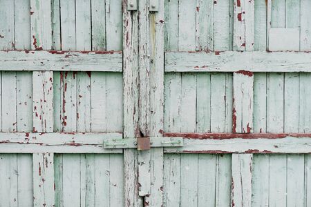 Old wooden fence painted blue textured background patternの写真素材