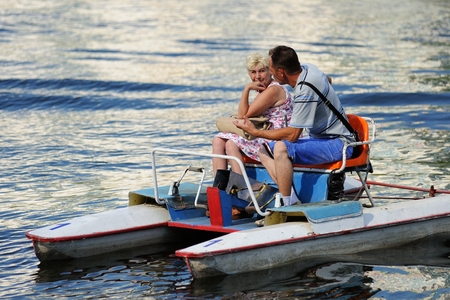 Orel, Russia - August 05, 2016: Orel city day. Couple sitting in pedal catamaran horizontalのeditorial素材
