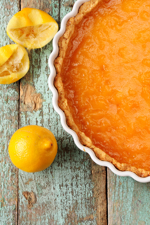 Lemon pie with fresh and squeezed lemon overhead viewの写真素材