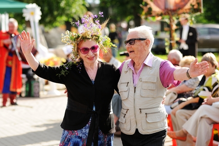 Orel, Russia - July 08, 2016: Russian Valentine Day  - Petr and Fevronia. Senior couple in sunglasses smiling and huggingのeditorial素材