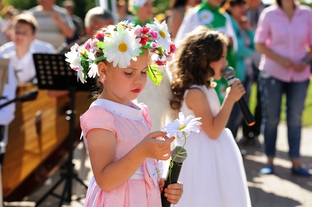 Orel, Russia - July 08, 2016: Russian Valentine Day  - Petr and Fevronia. Little girl in daisy...