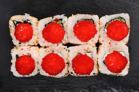 Set of fusion rolls with sesame seeds decorated with red caviar overhead viewの写真素材