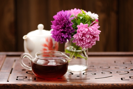 Bouquet of purple and pink asters and teaware for chinese tea ceremony copyspaceの写真素材