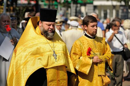 Orel, Russia - August 5, 2015: Orel Metropolitan Alexander performing service near common grave...