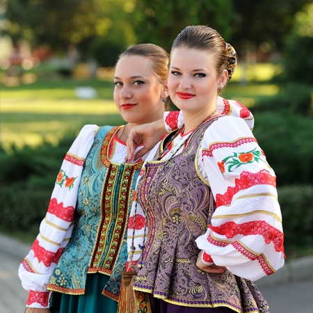 Orel, Russia, August 4, 2015: Orlovskaya Mozaika folk festival, two women in traditional Russian suits smiling squareのeditorial素材