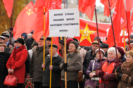 Orel, Russia - November 7, 2015: Communist party meeting. People with banners and red flags...