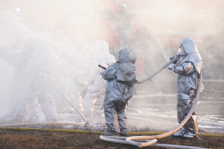 Orel, Russia - December 09, 2015: Emergency Control Ministry (MCHS) tactical exercise. Firefighter fighting fire on railway tank horizontalのeditorial素材
