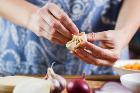 Woman making traditional Nepalese dumplings momos closeupの写真素材