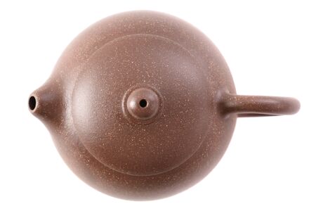 Little Chinese brown clay teapot for tea ceremony isolated on white background top viewの写真素材