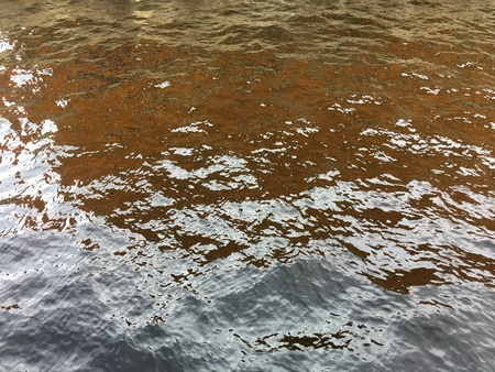 Water ripple with feflections  in city river texture background