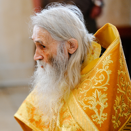 Orel, Russia, July 28, 2016: Russia Christianization anniversary Divine Liturgy. Hieromonk Iliya in golden robe selective focusのeditorial素材