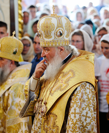 Orel, Russia, July 28, 2016: Russia Christianization anniversary Divine Liturgy. Patriarch Kirill thinking in crowd in orthodox churchのeditorial素材