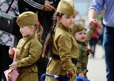 Orel, Russia, May 09, 2019: Victory Day, Immortal Regiment parade. Little children in WWII soldiers uniform walking in the street closeupのeditorial素材