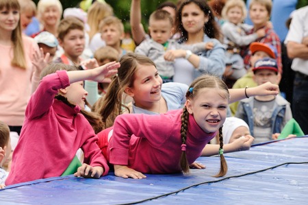 Orel, Russia, May 26, 2019: Twin Festival. Twin girls having fun at concert showのeditorial素材