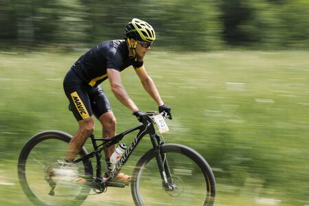 Orel, Russia, June 15, 2019: redBike Cup cross country cycle XCO competition. Young man riding...