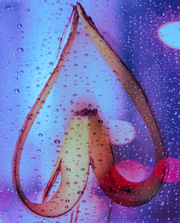 Abstract background with water drops on glass. Colorful abstract background.の写真素材