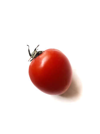 Red tomato isolated on white background. High resolution photo. Full depth of field.の写真素材