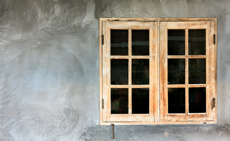The wood windows on the cement background.の写真素材